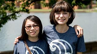 Two female students wearing Cove t-shirts